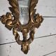 Italian mirror in gilded wood with gold leaf from the 18th century.
