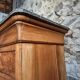 French antique walnut commode with a dark grey marble top, circa 1830–1860.