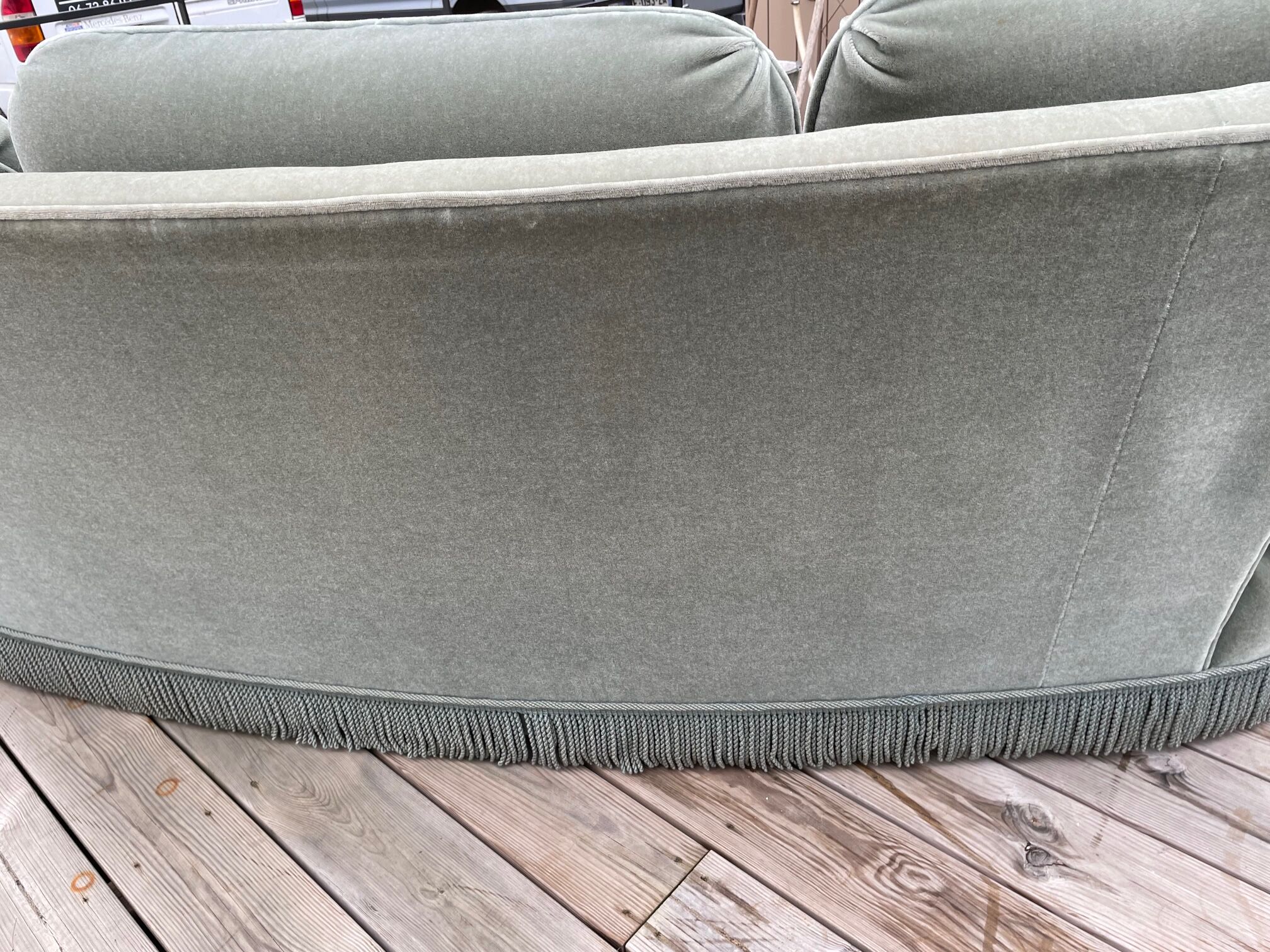 Rounded sofa with fringes