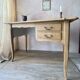 Antique 2-drawer desk in raw wood and beige, renovated.