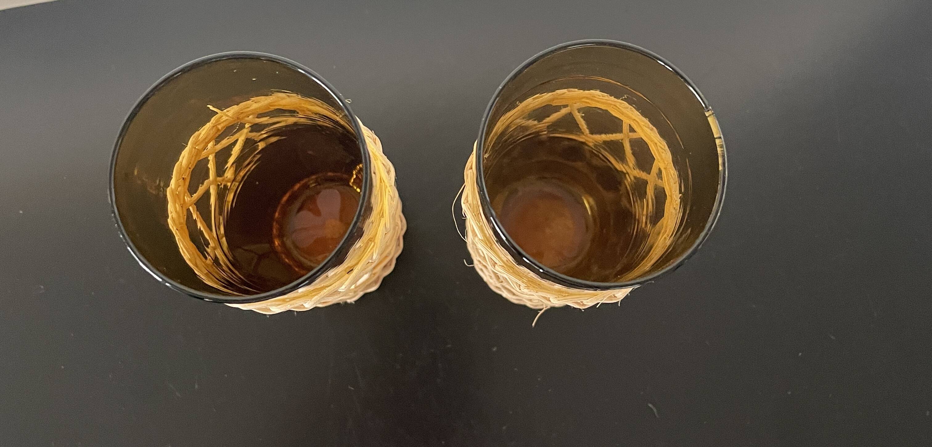 Set of 2 smoked orangeade glasses in woven wicker