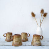 4 sandstone cups signed Jean Pierre Prudhomme