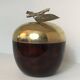 Apple-shaped ice bucket in red celluloid, gold-tone metal and plastic