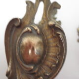 Pair of embraces in brass or bronze