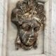 Female mascaron in grey Ardennes marble from the Regency period, 18th century.