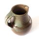 Signed stoneware pitcher