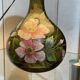 Blown glass lamp painted with a floral design, early 20th century.
