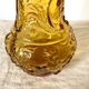 Bouteille, vase en verre ambré anges