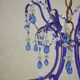 lustre bleu, fait de perles.