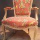 Louis XV style armchair upholstered with an Egyptian pattern.