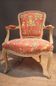 Louis XV style armchair upholstered with an Egyptian pattern.