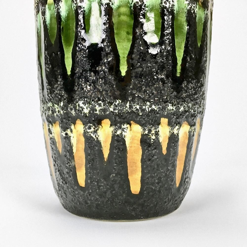 "Fat Lava" vase black background and colorful enamelled drippings