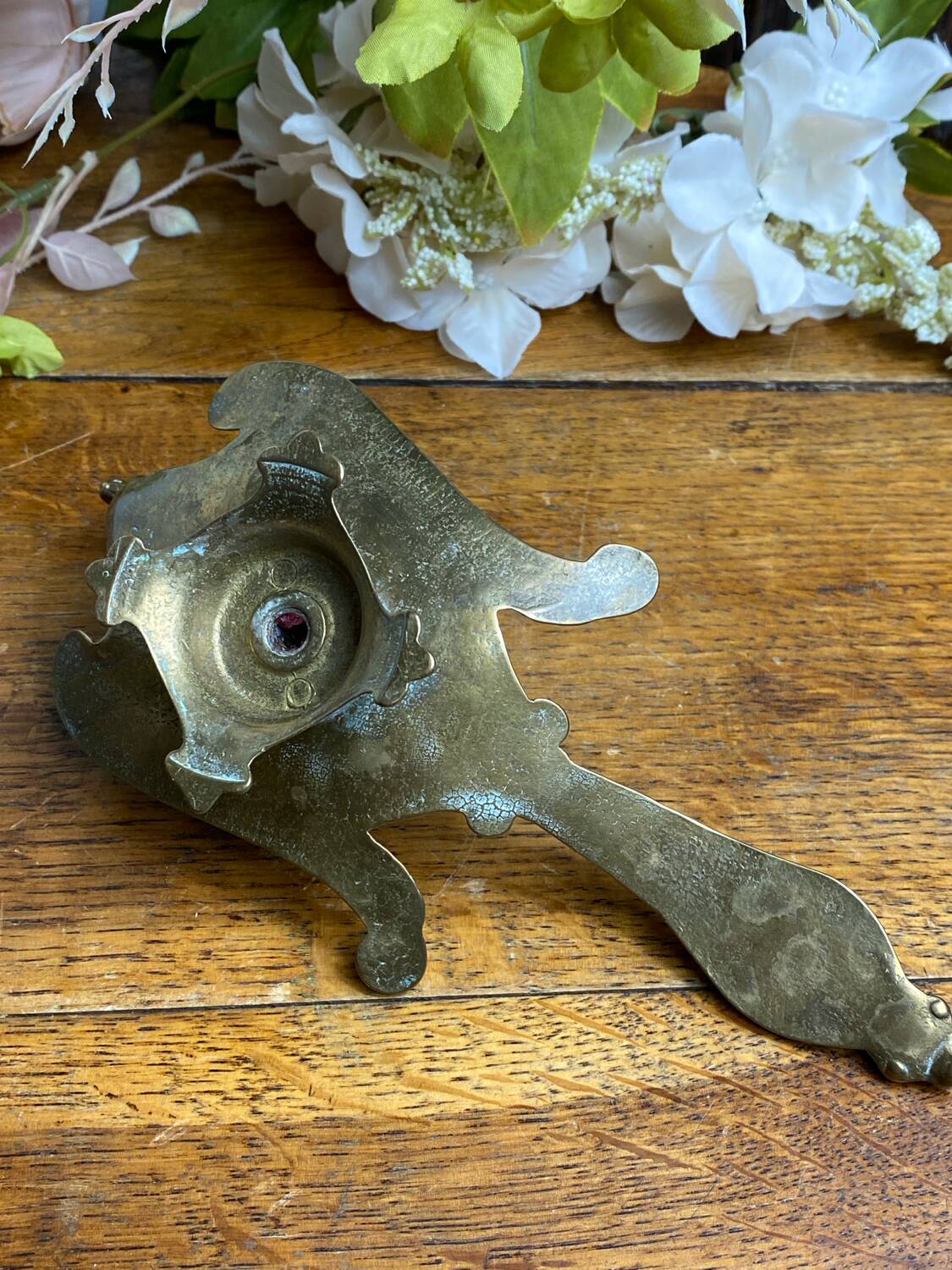 Hand candlestick, peacock shape, in bronze