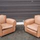 Pair of club chairs in skai