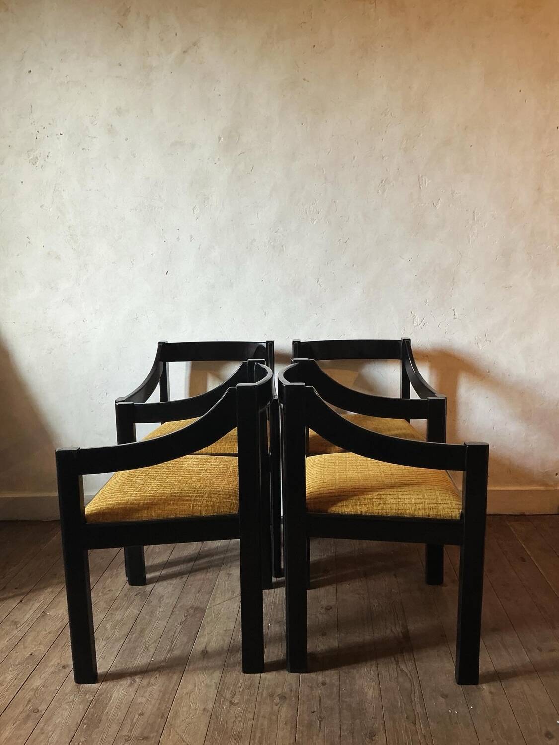 Four designer armchairs