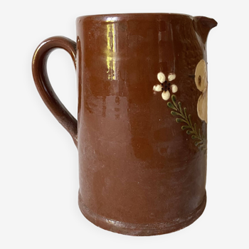 Terracotta pitcher with hand-painted bird decoration