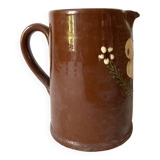 Terracotta pitcher with hand-painted bird decor