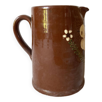 Terracotta pitcher with hand-painted bird decoration