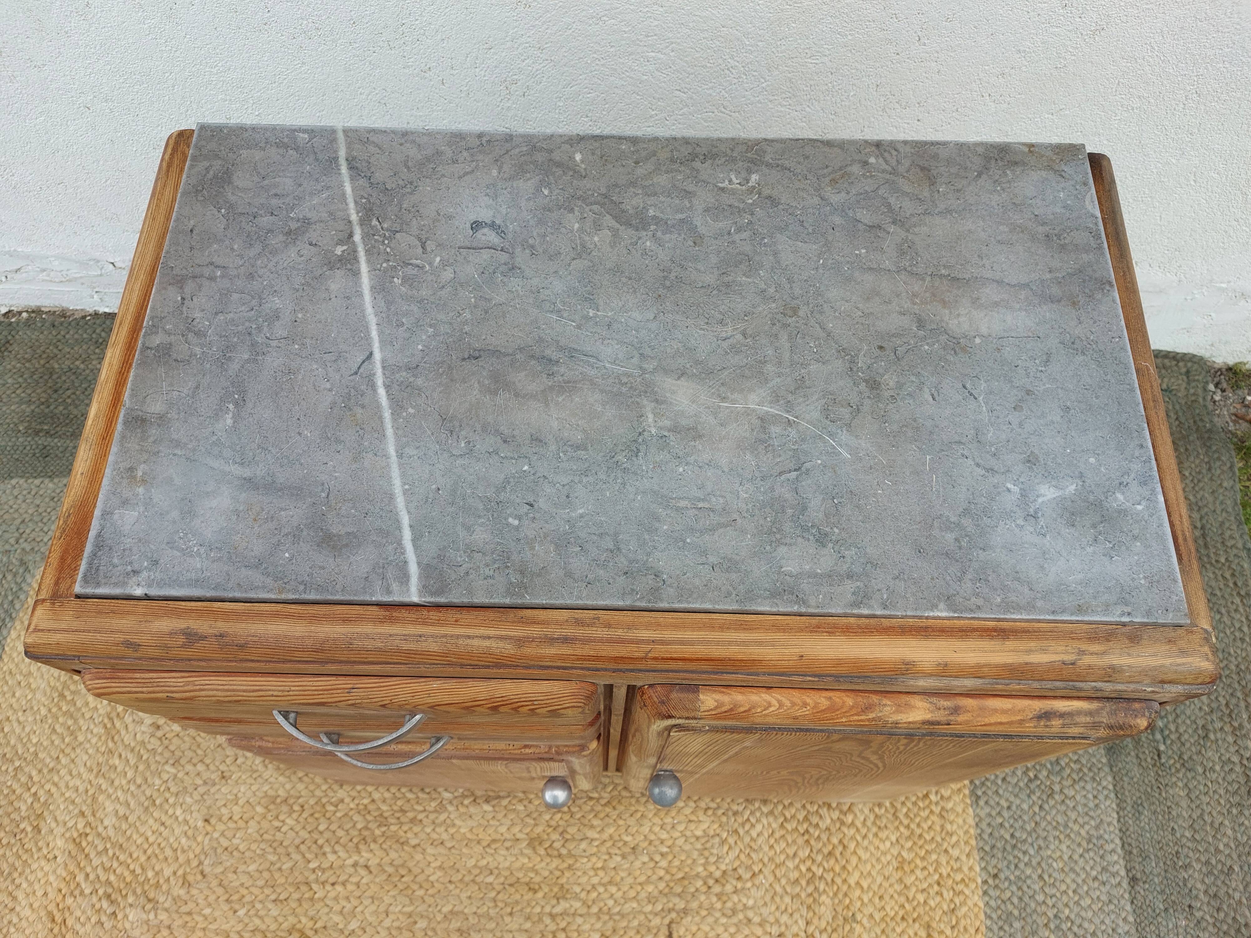 Vintage wooden buffet with a marble top.