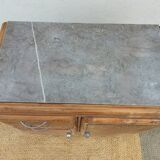 Vintage wooden buffet with a marble top.