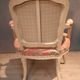 Louis XV style armchair upholstered with an Egyptian pattern.