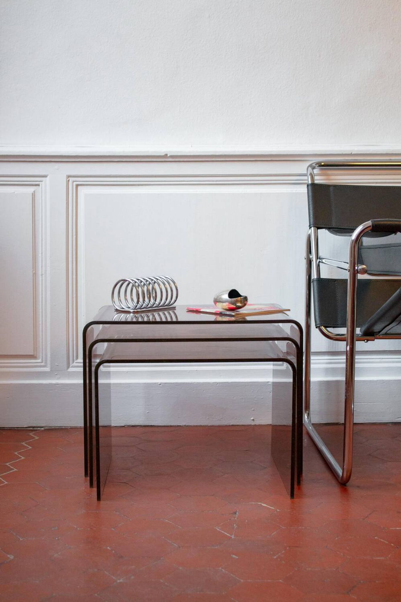 Vintage trio of nesting tables in smoked plexiglass by Michel Dumas, year.
