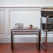 Vintage trio of nesting tables in smoked plexiglass by Michel Dumas, year.