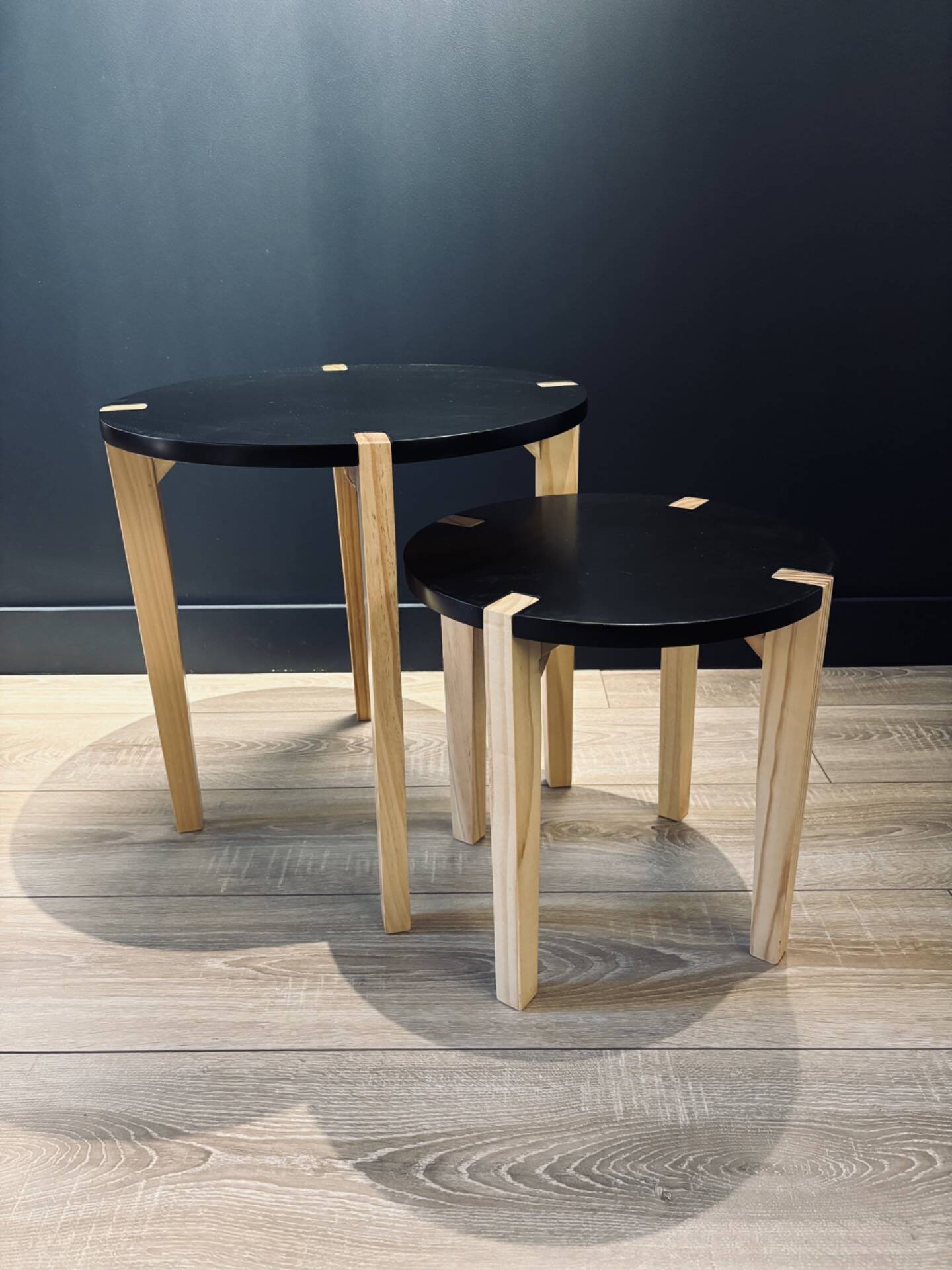 Set of round wooden and black side tables – Scandinavian style