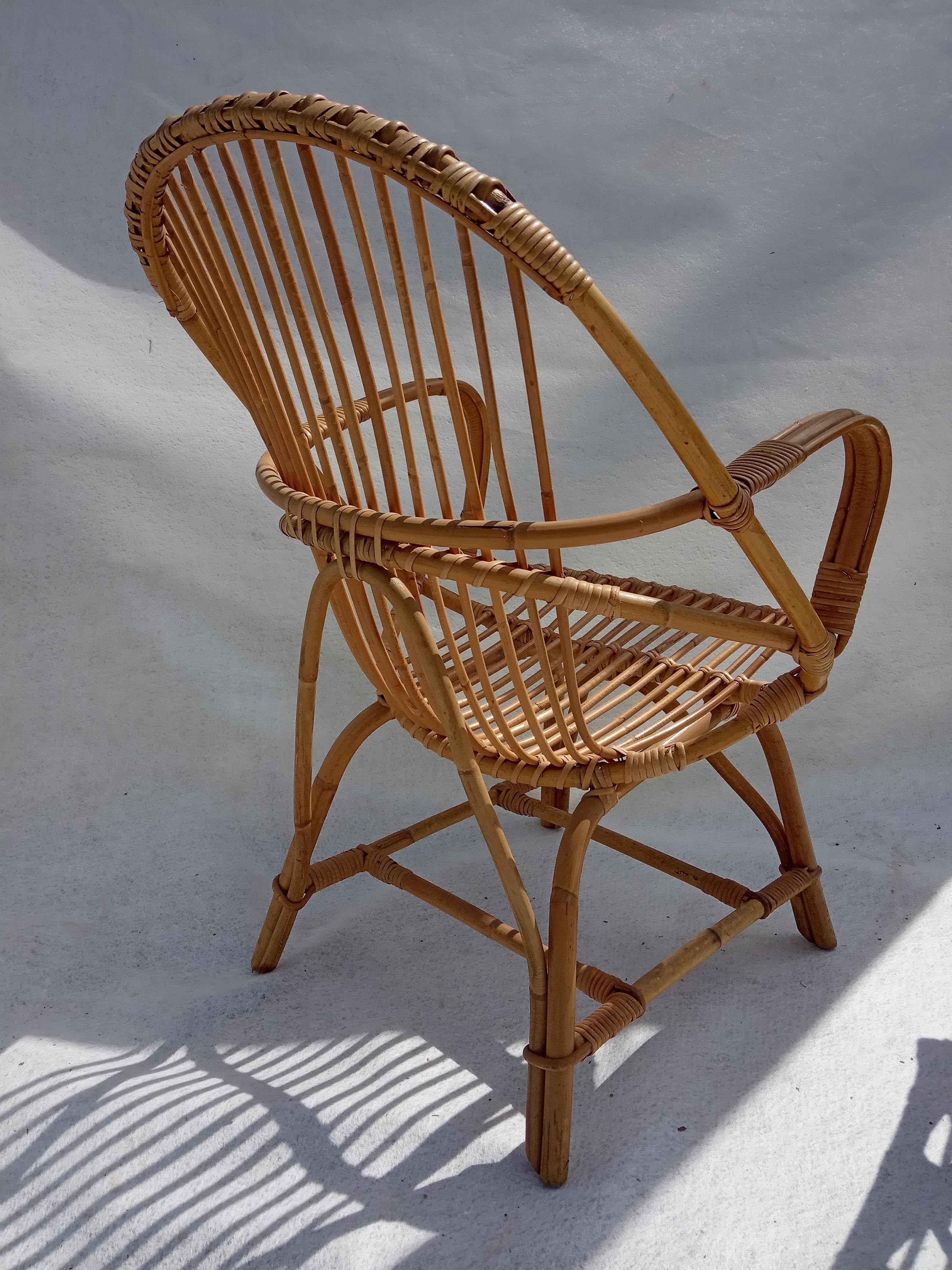 Armchair and footrest in rattan, years 50/60