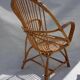 Armchair and footrest in rattan, years 50/60