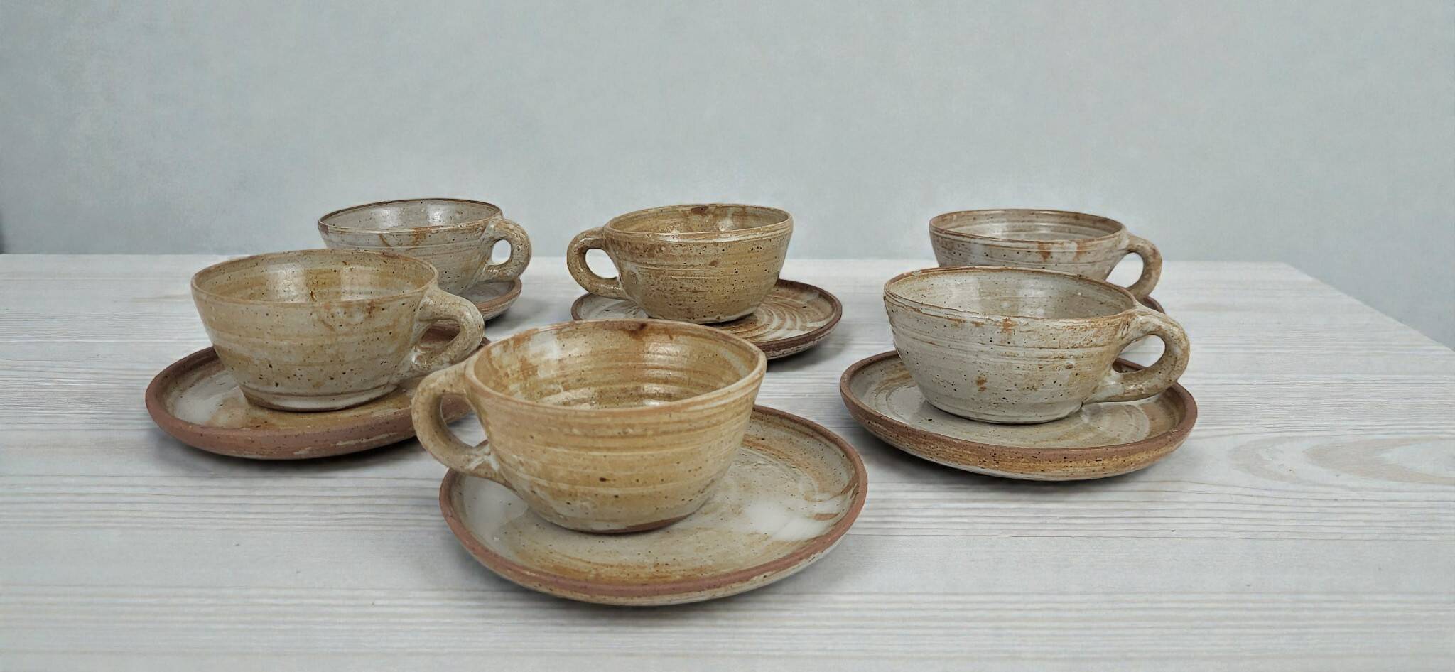 6 stoneware cups and saucers by Pierre Lion