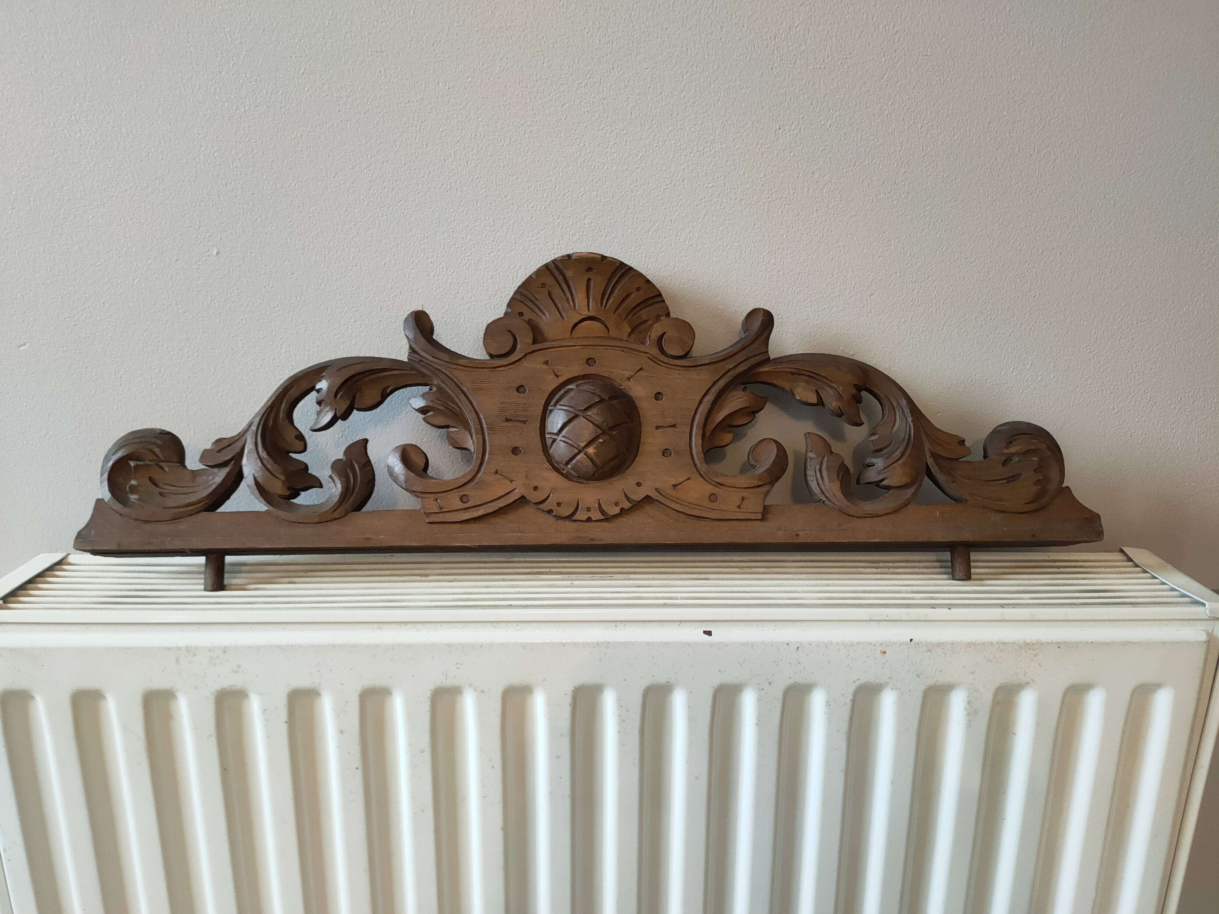 Old carved wooden pediment