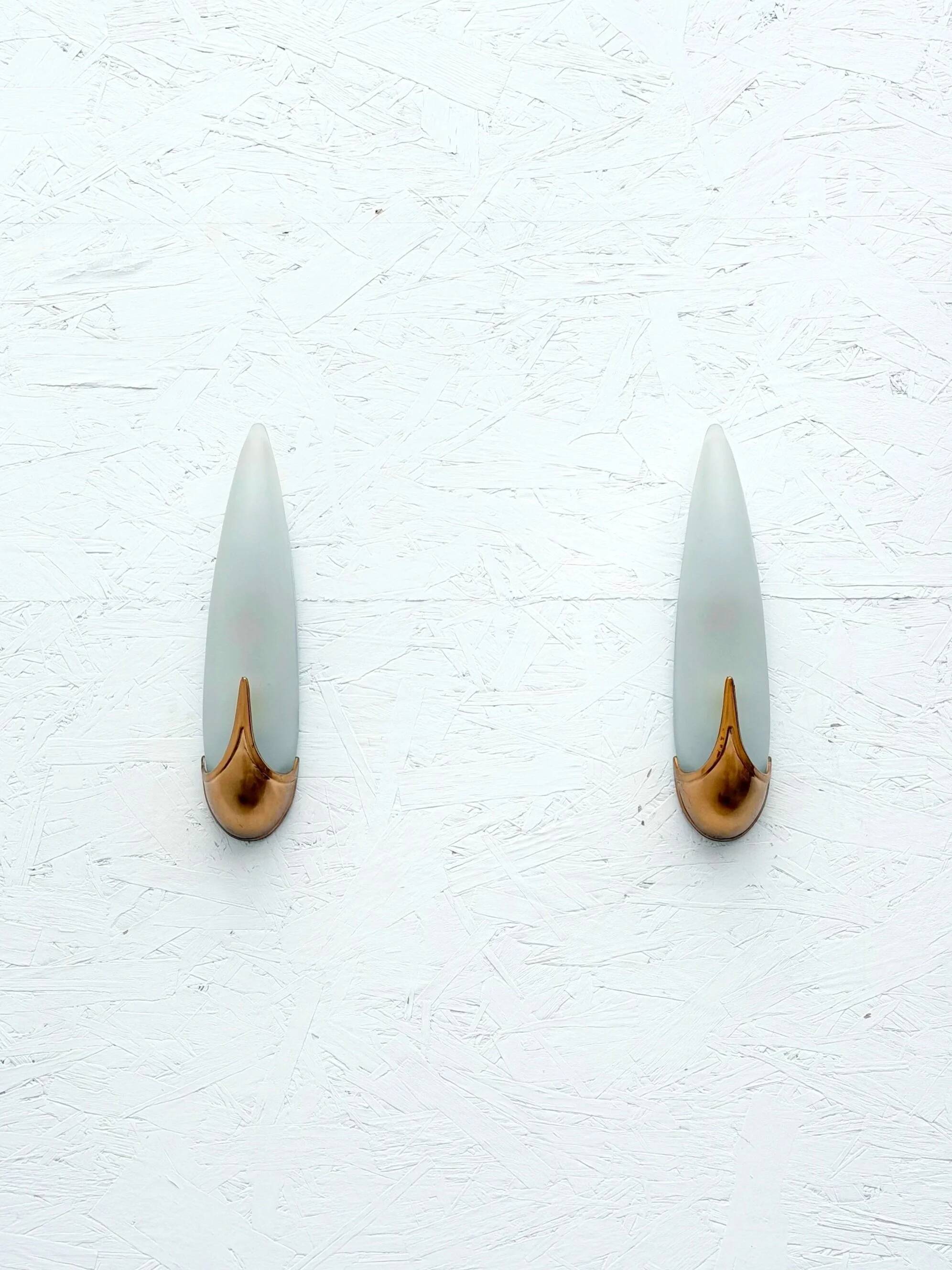 Pair of brass and opaline wall lights, Italy 1980.