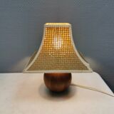 Very rare table lamp in turned teak wood with original braided shade. 1970s