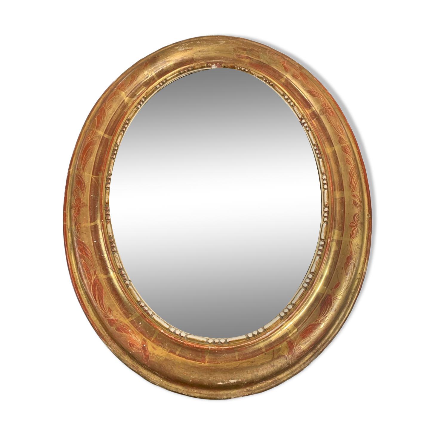 Golden oval mirror