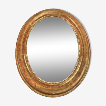 Golden oval mirror