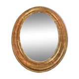 Golden oval mirror