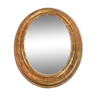 Golden oval mirror