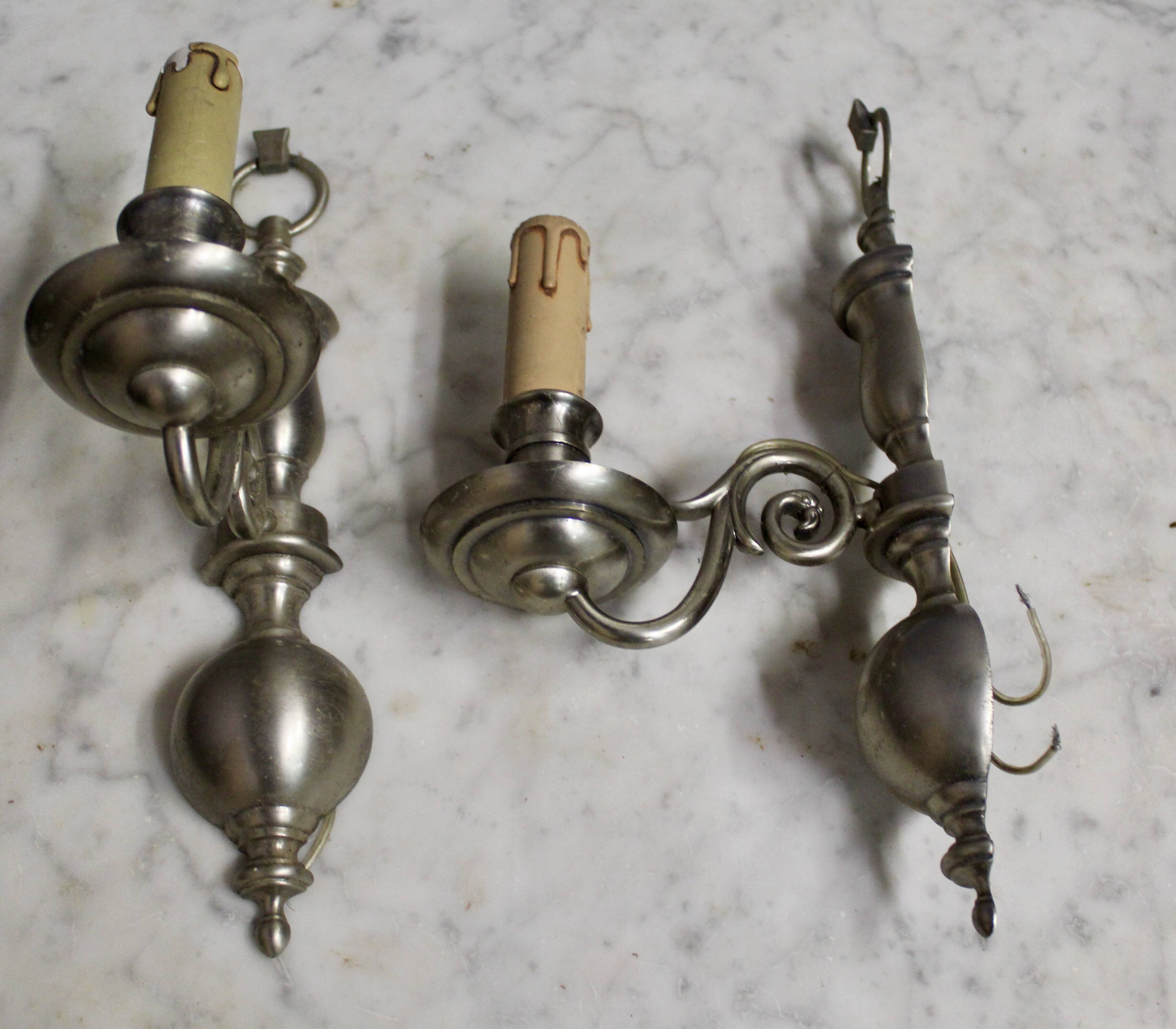 Pair of pewter-colored bronze wall sconces