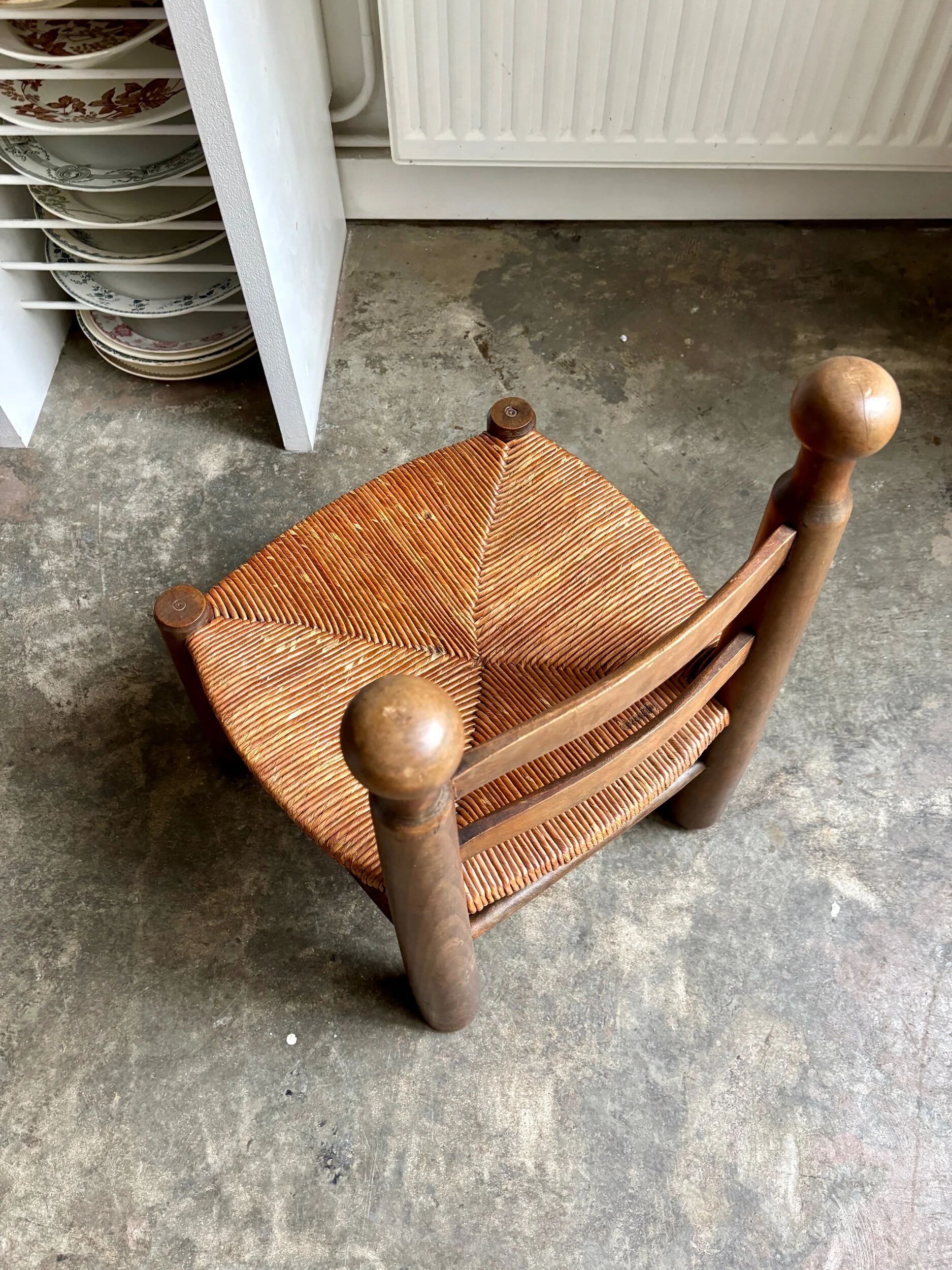 Low brutalist chair in dark wood and straw no. 2