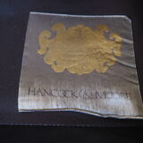 Chesterfield style fauteuil en cuir - tabouret par Hancock - Moore