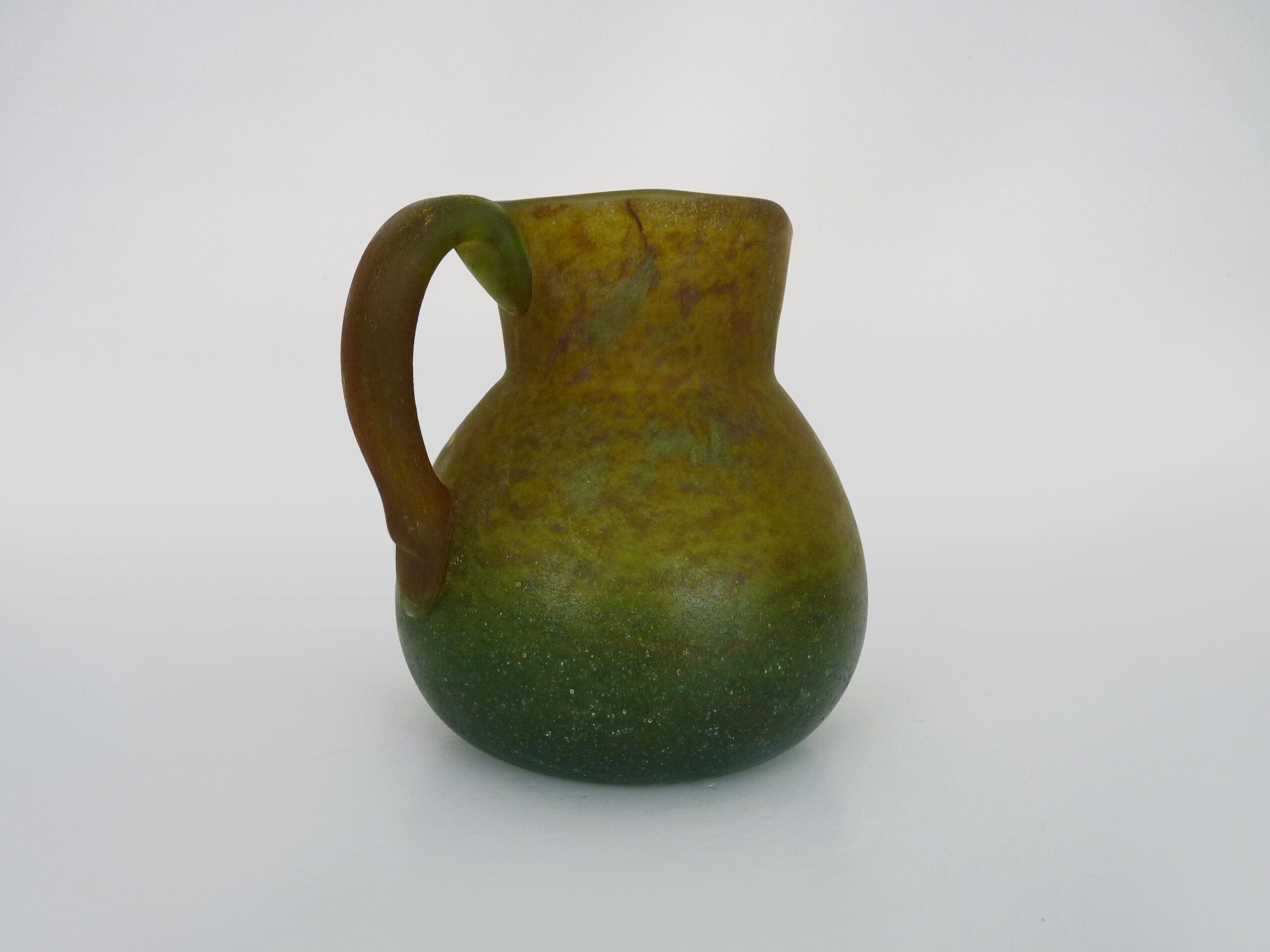 Pitcher in orange and green marble glass paste. Signed Georges De Feure for Daum