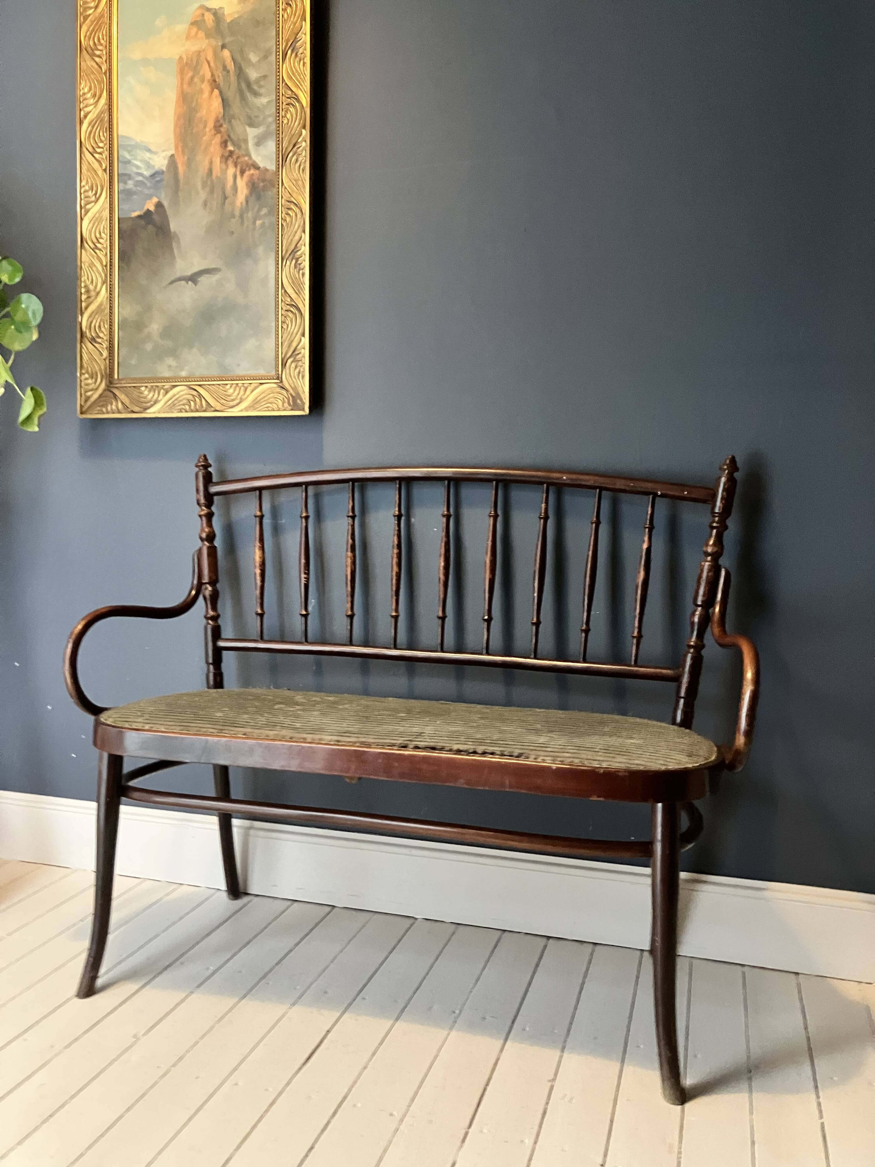 Thonet-branded bistro-style bench in turned wood, velvet and caning