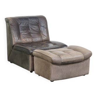 Gray leather design element/ armchair from the 70s + footstool
