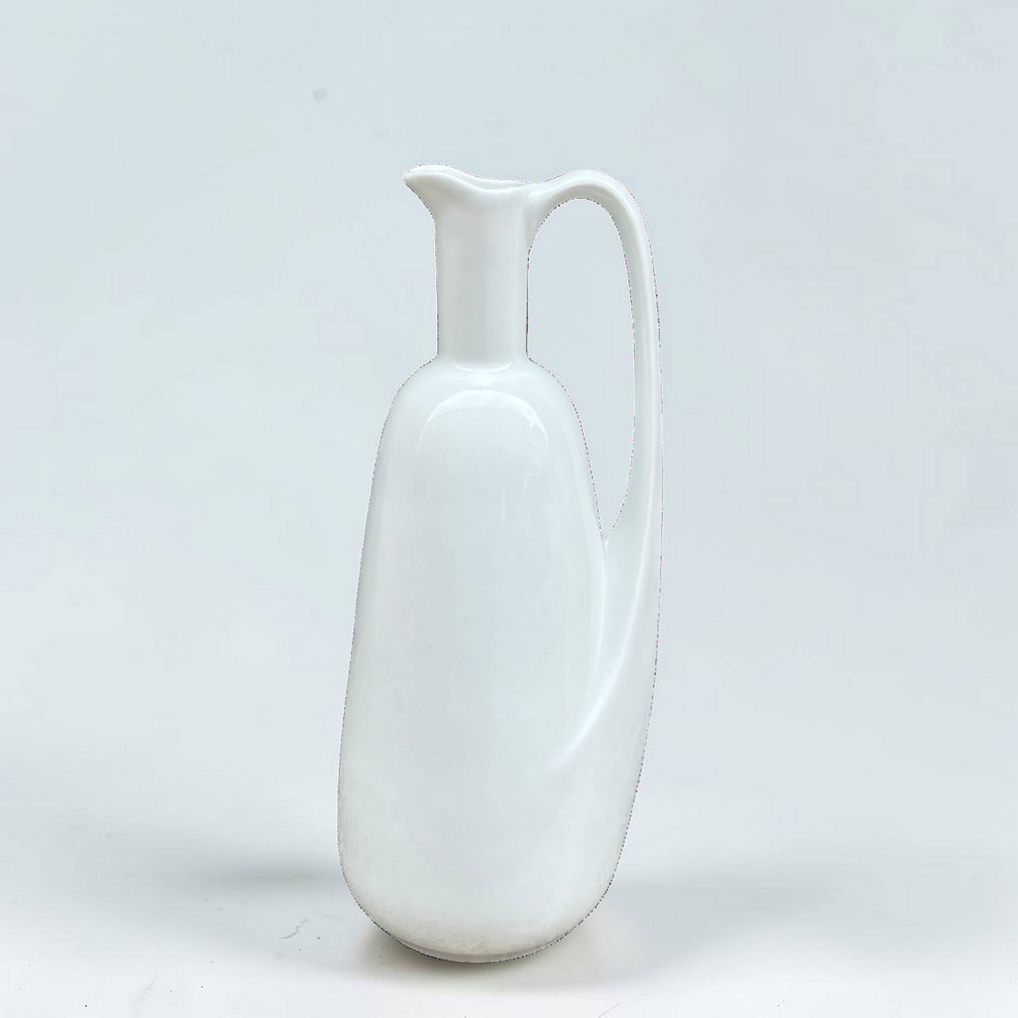 Modernist pitcher in vintage white porcelain water carafe in porcelain.