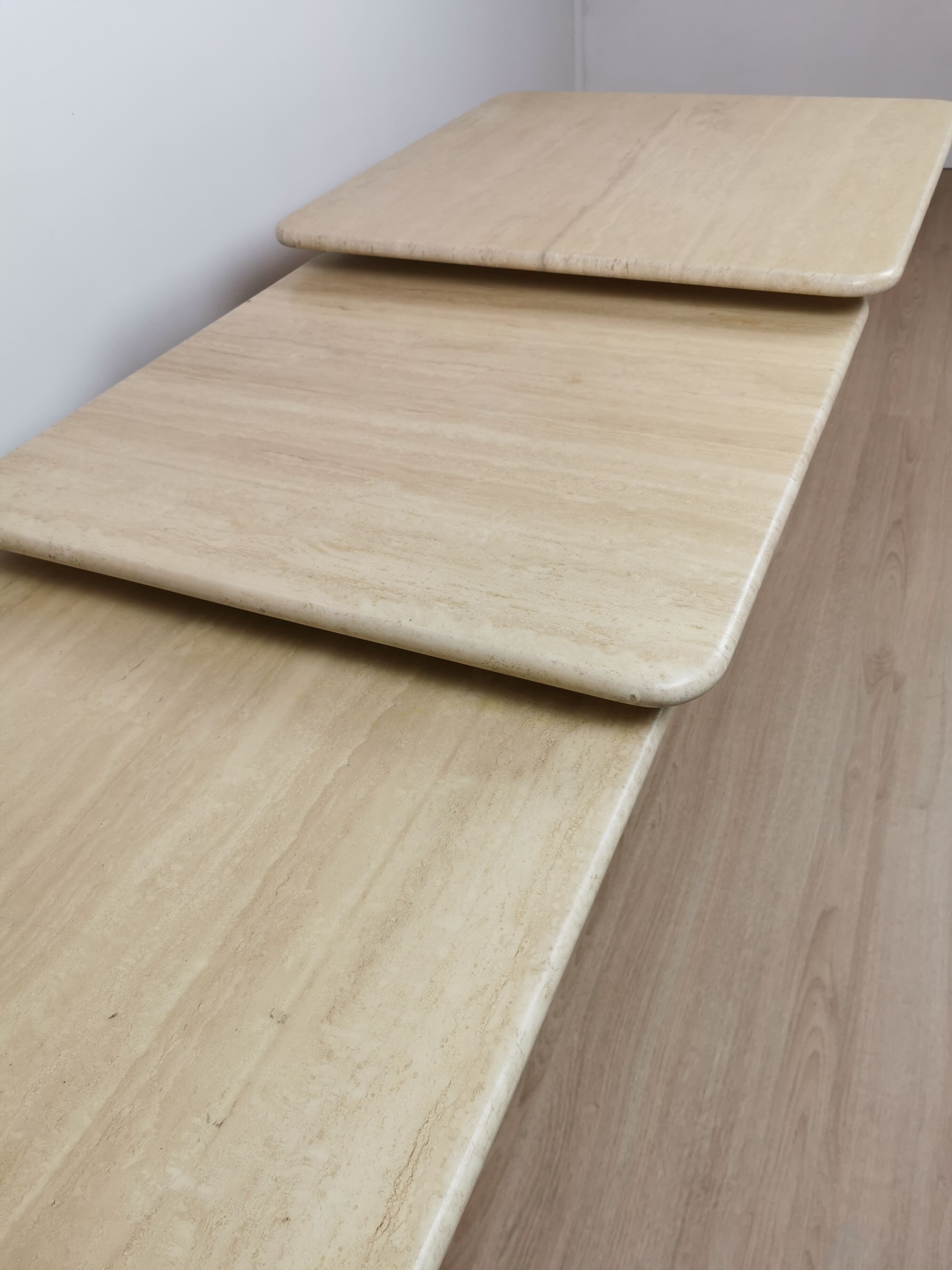 Side tables in travertine 70s