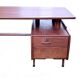Vintage 1950s teak desk by designer Jacques Hauville.