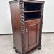 Art Nouveau cabinet with a shelf featuring distinctive floral sculptures.