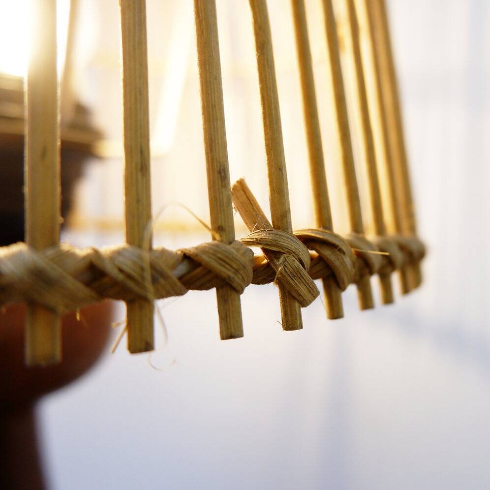 Wooden table lamp in the shape of a bowling pin with a bamboo shade from the 1960s.