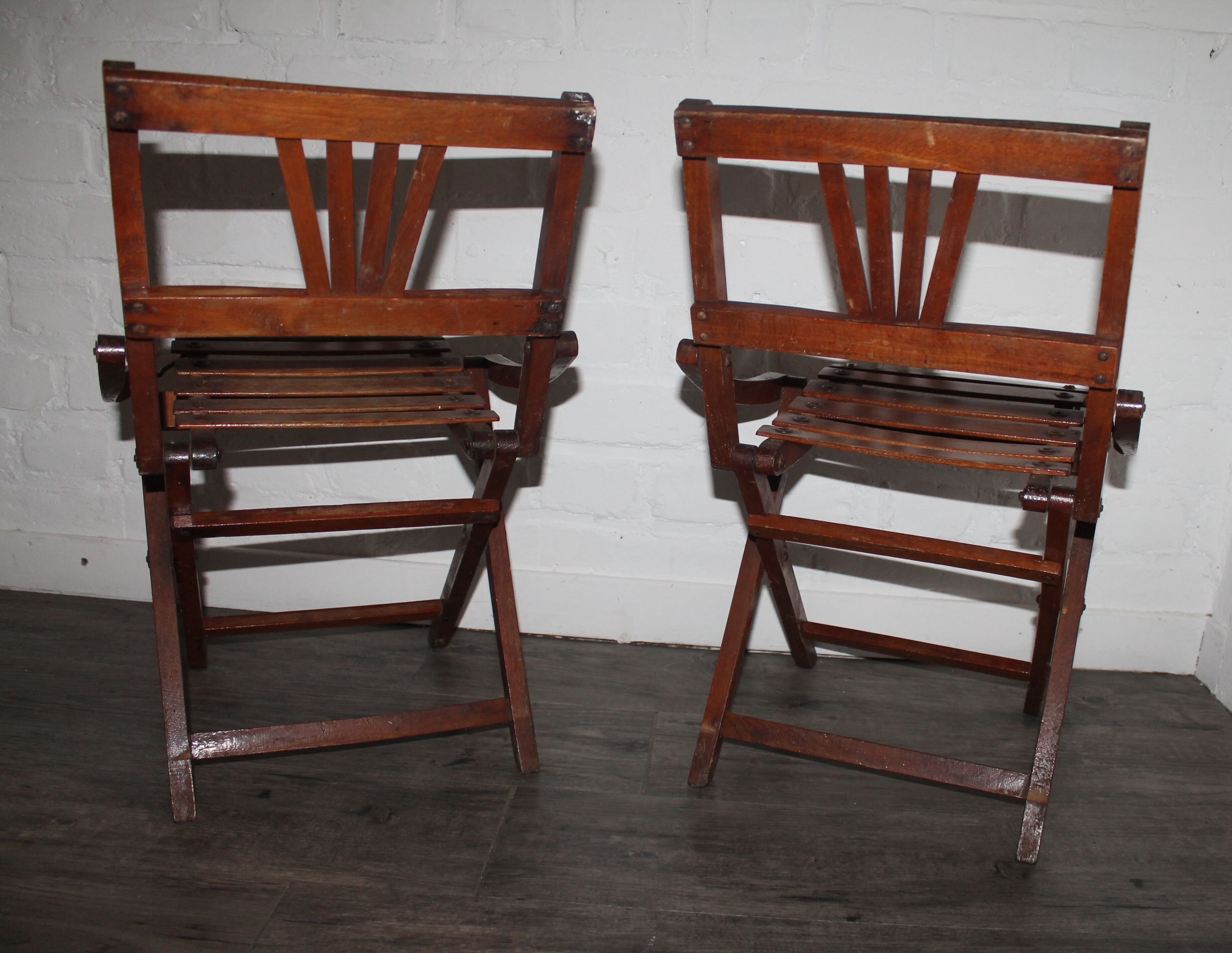 2 wooden folding chairs